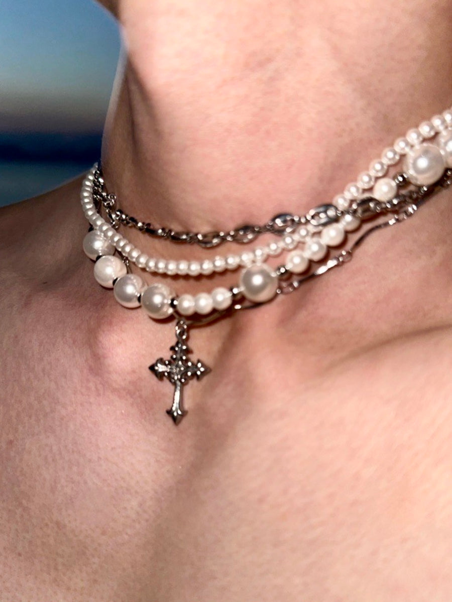 Opulent Chaos: Pearl Cross Titanium Necklace from the Luxury and Dissipation Collection