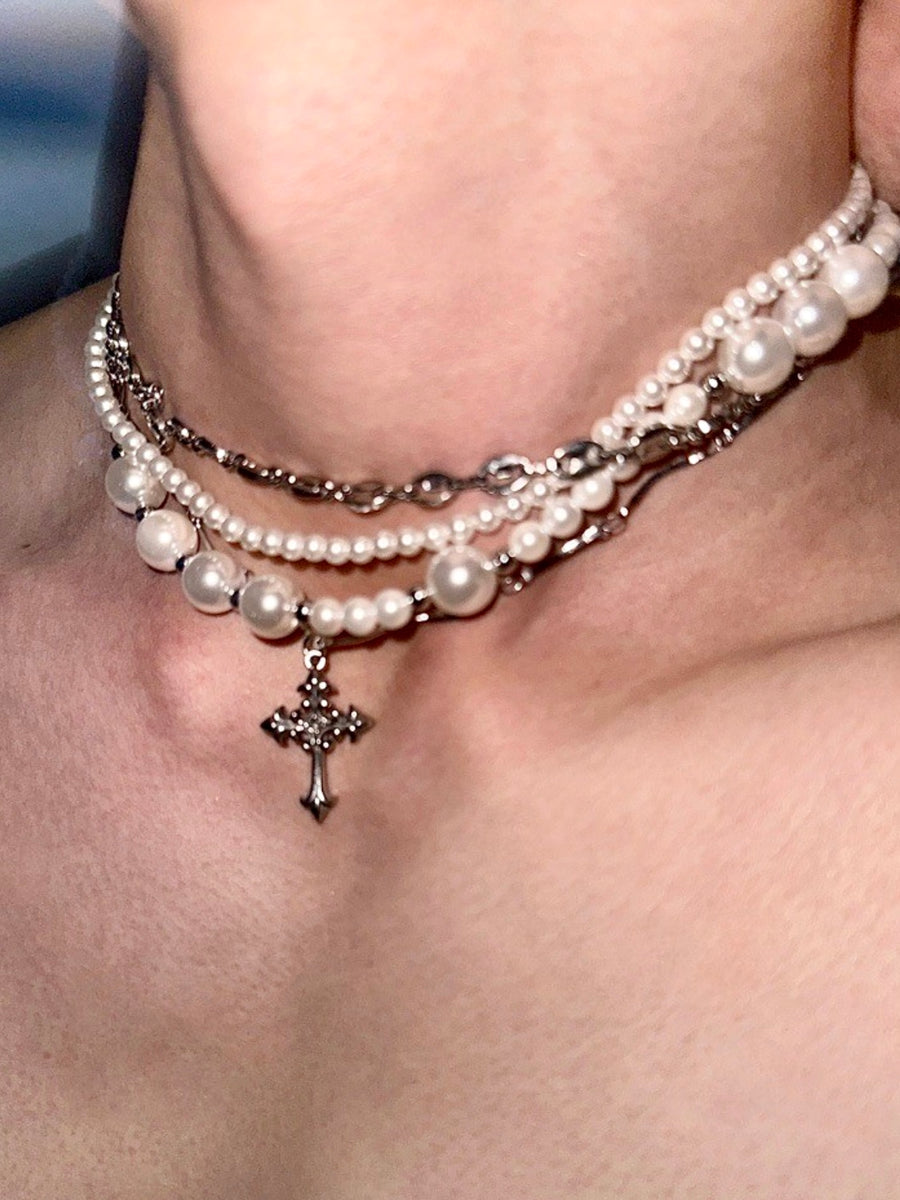 Opulent Chaos: Pearl Cross Titanium Necklace from the Luxury and Dissipation Collection