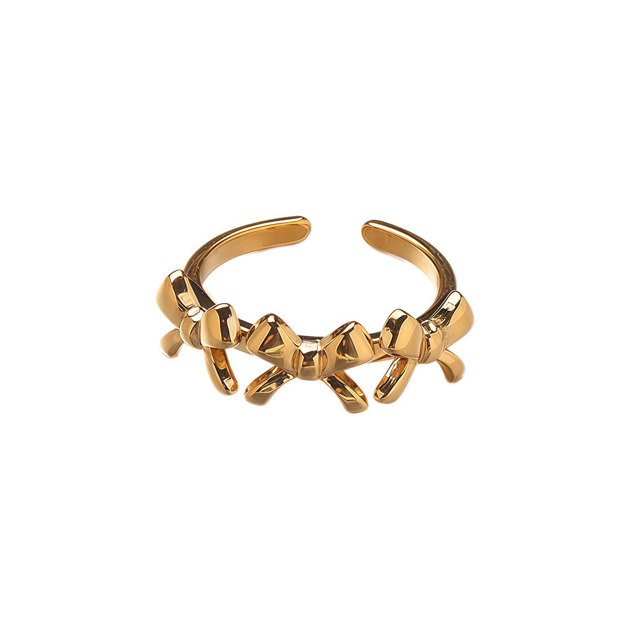 Golden Ribbon: The Bowed Elegance Ring